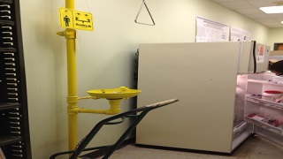 Cylinder hand truck blocking safety shower